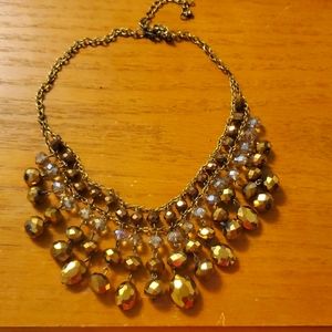 Bronze/gold women's drop beaded, choker-length necklace.